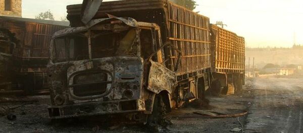 Damaged aid trucks are pictured after an airstrike on the rebel held Urm al-Kubra town, western Aleppo city, Syria September 20, 2016 Damaged aid trucks are pictured after an airstrike on the rebel held Urm al-Kubra town, western Aleppo city, Syria September 20, 2016 - Sputnik International