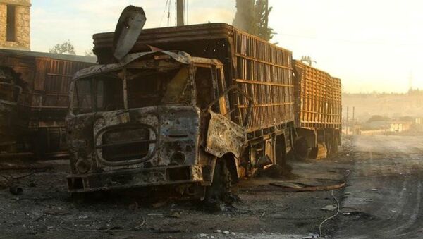 Damaged aid trucks are pictured after an airstrike on the rebel held Urm al-Kubra town, western Aleppo city, Syria September 20, 2016 - Sputnik International