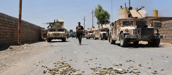 Shell casings lie on the ground as Iraqi government forces gather around the Qayyarah airbase, which was seized by Iraqi forces last week from jihadists of the Islamic State (IS)group, on July 13, 2016, some 60 kilometres (35 miles) south of Mosul Shell casings lie on the ground as Iraqi government forces gather around the Qayyarah airbase, which was seized by Iraqi forces last week from jihadists of the Islamic State (IS)group, on July 13, 2016, some 60 kilometres (35 miles) south of Mosul - Sputnik International