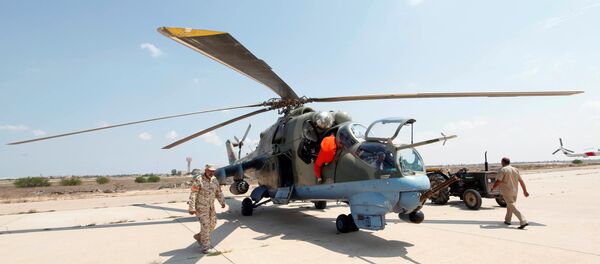 Members of Libyan forces allied with the UN-backed government prepare a renovated Libyan helicopter at Misurata air base, Libya September 4, 2016 Members of Libyan forces allied with the UN-backed government prepare a renovated Libyan helicopter at Misurata air base, Libya September 4, 2016 - Sputnik International