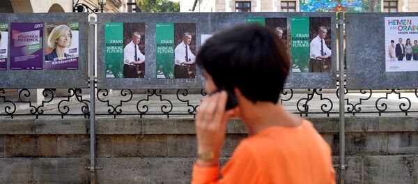 A woman walks past election posters for Basque nationalist Party (PNV) candidate, Inigo Urkullu, in the Basque town of Guernica, northern Spain, September 21, 2016. A woman walks past election posters for Basque nationalist Party (PNV) candidate, Inigo Urkullu, in the Basque town of Guernica, northern Spain, September 21, 2016. - Sputnik International