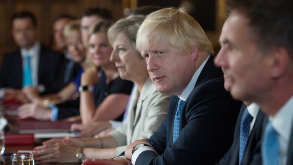 British Foreign Secretary Boris Johnson (2R) sits next to British Prime Minister Theresa May (3R) during a meeting of the cabinet at the Prime Minister's country retreat Chequers near the village of Ellesborough in Buckinghamshire, northwest of London, on August 31, 2016. - Sputnik International