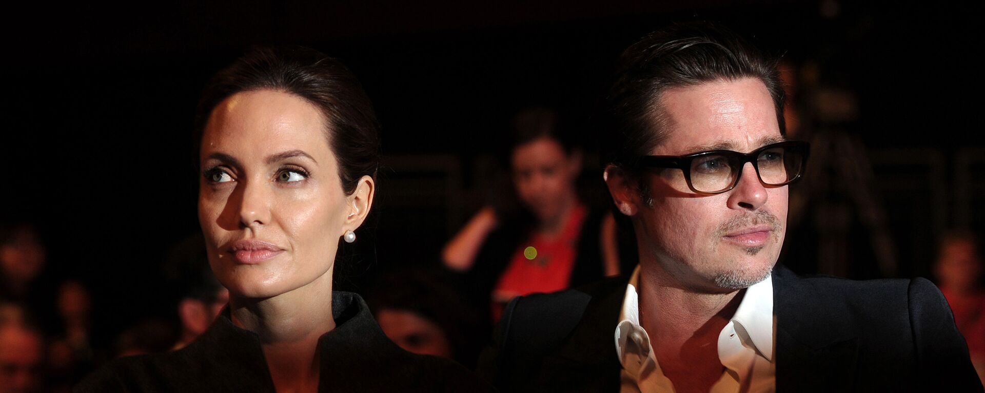 This file photo taken on June 13, 2014 shows US actress and special UN envoy Angelina Jolie (L) and her husband US actor Brad Pitt attending the fourth day of the Global Summit to End Sexual Violence in Conflict in London. - Sputnik International, 1920, 12.06.2022