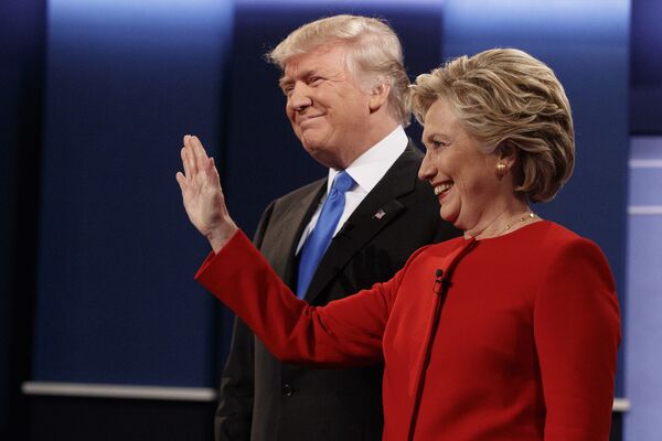 Republican presidential candidate Donald Trump, left, stands with Democratic presidential candidate Hillary Clinton before the first presidential debate at Hofstra University, Monday, Sept. 26, 2016, in Hempstead, N.Y. - Sputnik International