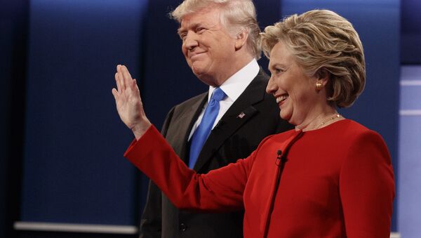 Republican presidential candidate Donald Trump, left, stands with Democratic presidential candidate Hillary Clinton before the first presidential debate at Hofstra University, Monday, Sept. 26, 2016, in Hempstead, N.Y. - Sputnik International