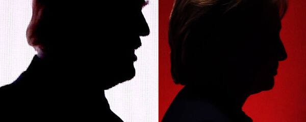 This combination of file photos shows the silhouettes of Republican presidential nominee Donald Trump(R) July 18, 2016 and Democratic presidential nominee Hillary Clinton on February 4, 2016. - Sputnik International