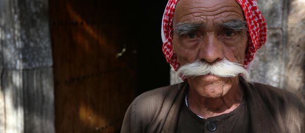Iraqi Yazidi worshippers arrive at the Lalish temple in a valley near the Kurdish city of Dohuk, 430 km (260 miles) northwest of Baghdad, on May 21, 2015. Iraqi Yazidi worshippers arrive at the Lalish temple in a valley near the Kurdish city of Dohuk, 430 km (260 miles) northwest of Baghdad, on May 21, 2015. - Sputnik International