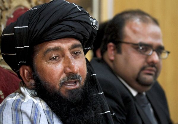 Pakistani Journalist Kareem Khan Sits With his lawyer Mirza Shahzad Akbar. Khan sued the US for the death of his brother and son in a CIA drone strike. Pakistani Journalist Kareem Khan Sits With his lawyer Mirza Shahzad Akbar. Khan sued the US for the death of his brother and son in a CIA drone strike. - Sputnik International