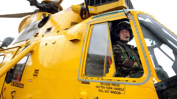 Britain's Prince William is pictured at the controls of a Sea King helicopter during a training exercise at Holyhead Mountain, having flown from RAF Valley in Anglesey, north Wales, on March 31, 2011 - Sputnik International