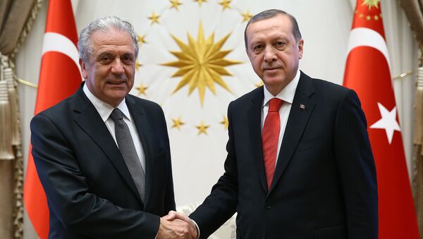 Turkish President Recep Tayyip Erdogan, right, and European Commissioner for Migration Dimitris Avramopoulos shake hands before a meeting in Ankara, Turkey, Monday, April 4, 2016. - Sputnik International