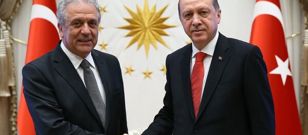 Turkish President Recep Tayyip Erdogan, right, and European Commissioner for Migration Dimitris Avramopoulos shake hands before a meeting in Ankara, Turkey, Monday, April 4, 2016. Turkish President Recep Tayyip Erdogan, right, and European Commissioner for Migration Dimitris Avramopoulos shake hands before a meeting in Ankara, Turkey, Monday, April 4, 2016. - Sputnik International
