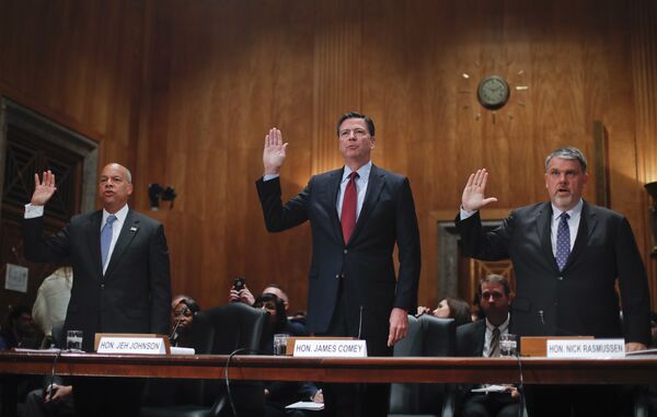 From left, Homeland Secretary Jeh Johnson, FBI Director James Comey, and Director of National Counterterrorism Center, Office of the National Intelligence, Nicholas J. Rasmussen are sworn-in on Capitol Hill in Washington prior to testifying before the Senate Homeland Security and Governmental Affairs Committee hearing on terror threats. File photo  - Sputnik International