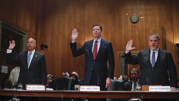 From left, Homeland Secretary Jeh Johnson, FBI Director James Comey, and Director of National Counterterrorism Center, Office of the National Intelligence, Nicholas J. Rasmussen are sworn-in on Capitol Hill in Washington prior to testifying before the Senate Homeland Security and Governmental Affairs Committee hearing on on terror threats - Sputnik International