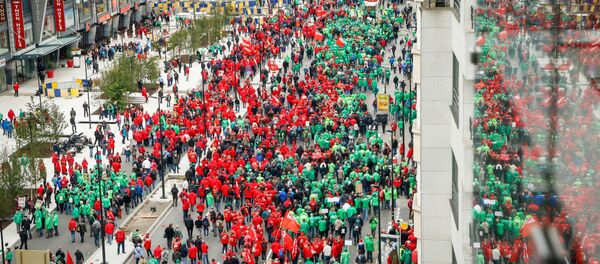 Trade Union members march through the streets during an anti-austerity demonstration in Brussels on October 7, 2015 Trade Union members march through the streets during an anti-austerity demonstration in Brussels on October 7, 2015 - Sputnik International