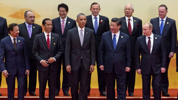 Leaders pose for a group photo at the Asia-Pacific Economic Cooperation (APEC) summit at the International Convention Center in Yanqi Lake, Beijing, on Tuesday, Nov. 11, 2014 - Sputnik International
