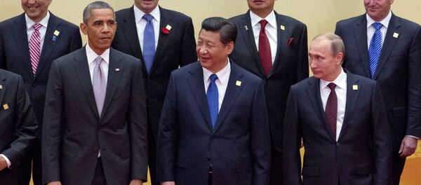 Leaders pose for a group photo at the Asia-Pacific Economic Cooperation (APEC) summit at the International Convention Center in Yanqi Lake, Beijing, on Tuesday, Nov. 11, 2014 Leaders pose for a group photo at the Asia-Pacific Economic Cooperation (APEC) summit at the International Convention Center in Yanqi Lake, Beijing, on Tuesday, Nov. 11, 2014 - Sputnik International