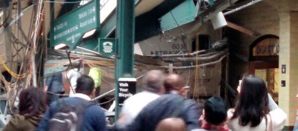 Onlookers view a New Jersey Transit train that derailed and crashed through the station in Hoboken, New Jersey, U.S. in this picture courtesy of Chris Lantero taken September 29, 2016 Onlookers view a New Jersey Transit train that derailed and crashed through the station in Hoboken, New Jersey, U.S. in this picture courtesy of Chris Lantero taken September 29, 2016 - Sputnik International