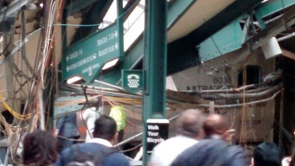 Onlookers view a New Jersey Transit train that derailed and crashed through the station in Hoboken, New Jersey, U.S. in this picture courtesy of Chris Lantero taken September 29, 2016 - Sputnik International