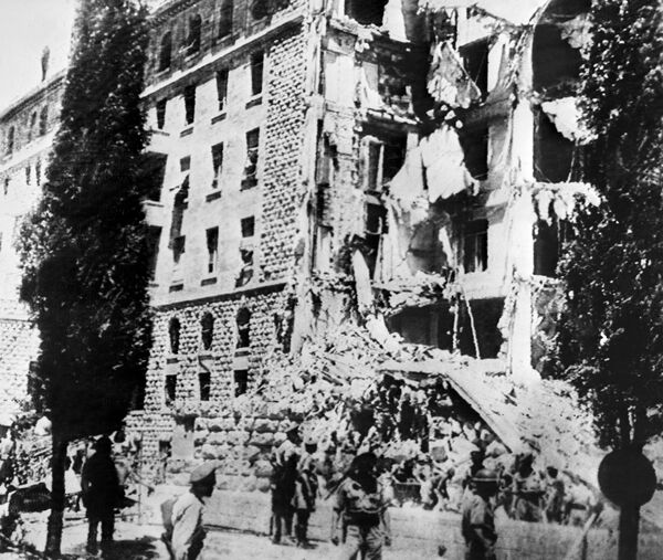 A picture taken 22 July 1946 shows the King David Hotel in Jerusalem, which housed the British Headquarters, damaged after a bombing attack against the British government by members of Irgun, a Zionist terrorist group headed by Menachem Begin. A picture taken 22 July 1946 shows the King David Hotel in Jerusalem, which housed the British Headquarters, damaged after a bombing attack against the British government by members of Irgun, a Zionist terrorist group headed by Menachem Begin. - Sputnik International