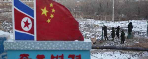 North Korean and Chinese national flags (File) North Korean and Chinese national flags (File) - Sputnik International