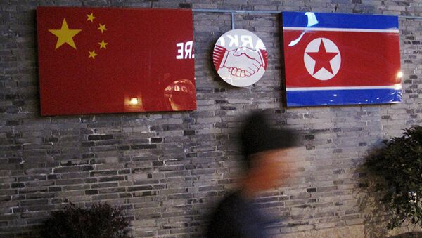 Chinese and  North Korean national flags (File) - Sputnik International