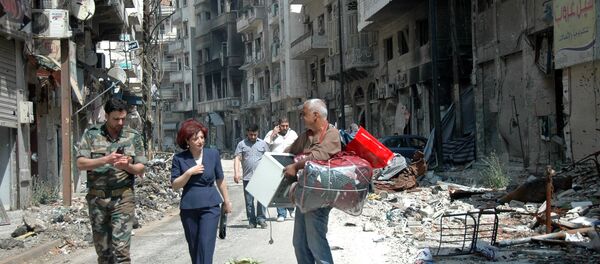 Syrians residents of Homs return to the old town of Syria's central city (File) - Sputnik International