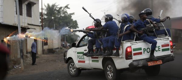 Burundi riot police fire tear gas as they chase demonstrators during clashes in Bujumbura, Burundi, Wednesday April 29, 2015 Burundi riot police fire tear gas as they chase demonstrators during clashes in Bujumbura, Burundi, Wednesday April 29, 2015 - Sputnik International