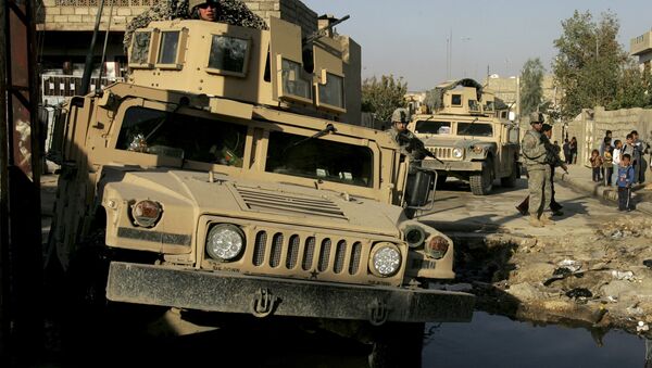 U.S. Army soldiers of Lightning Troop, 3rd Squadron, 3rd Armored Cavalry Regiment, make their way across a street flooded with sewage with their military vehicles, during a routine patrol in Al Islah Al Serai neighborhood, northwestern Mosul, 360 kilometers (224 miles) northwest of Baghdad, Iraq  (File) - Sputnik International