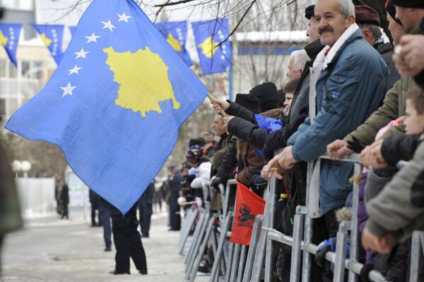 Kosovo Albanians wave the Kosovo flag during a celebration marking the 4th anniversary of the Kosovo's declaration of independence in Pristina on February 17, 2012 - Sputnik International