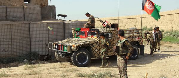 Afghan National Army (ANA) soldiers stand next to an outpost where 12 soldiers were killed by their comrades in the northern city of Kunduz, Afghanistan September 27, 2016 Afghan National Army (ANA) soldiers stand next to an outpost where 12 soldiers were killed by their comrades in the northern city of Kunduz, Afghanistan September 27, 2016 - Sputnik International