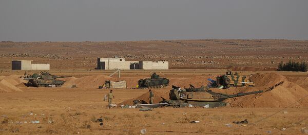 Turkish army soldiers walk past their tanks and armored vehicles in the northern Syrian rebel-controlled town of al-Rai, in Aleppo Governorate, Syria, September 27, 2016 - Sputnik International