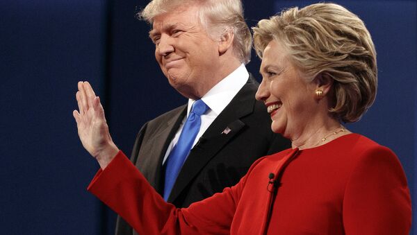 Republican presidential candidate Donald Trump, left, stands with Democratic presidential candidate Hillary Clinton at the first presidential debate at Hofstra University, Monday, Sept. 26, 2016, in Hempstead, N.Y. - Sputnik International
