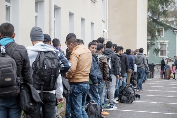 Migrants queue in front of a refugee reception centre in Tornio,Finland (file) Migrants queue in front of a refugee reception centre in Tornio,Finland (file) - Sputnik International