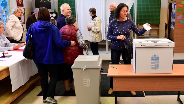 Voters are pictured at a polling station in Budapest - Sputnik International