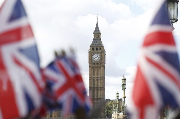 Union flags on sale at a souvenir stall fly in the breeze opposite the Houses of Parliament in London, Britain Union flags on sale at a souvenir stall fly in the breeze opposite the Houses of Parliament in London, Britain - Sputnik International