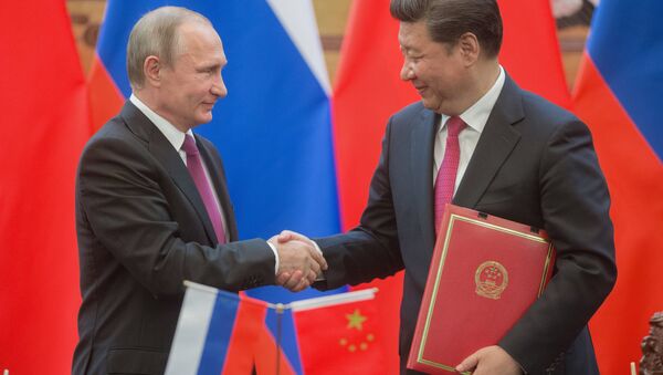 Russian President Vladimir Putin, left, and President of the People's Republic of China Xi Jinping during a signing ceremony of documents following their talks in Beijing. (File) - Sputnik International