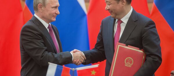 Russian President Vladimir Putin, left, and President of the People's Republic of China Xi Jinping during a signing ceremony of documents following their talks in Beijing. (File) - Sputnik International