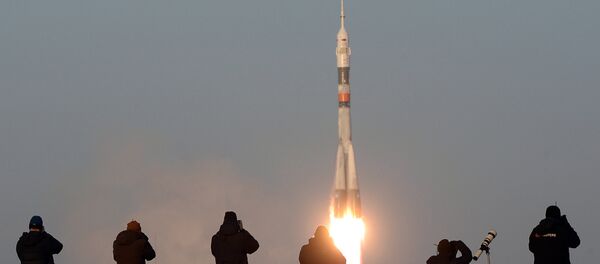 The launch of a Soyuz-FG rocket with the Soyuz TMA-19M manned spacecraft from the Baikonur Space Center. - Sputnik International