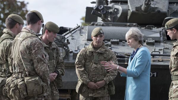 Prime Minister Theresa May greets troops as she visits 1st Battalion The Mercian Regiment (Cheshire, Worcesters and Foresters, and Staffords) at their barracks at Bulford Camp on September 29, 2016 near Salisbury, England. The Prime Minister visited the military base in the Salisbury Plain area to meet with soldiers, see the equipment they work with and to also meet with some their families - Sputnik International