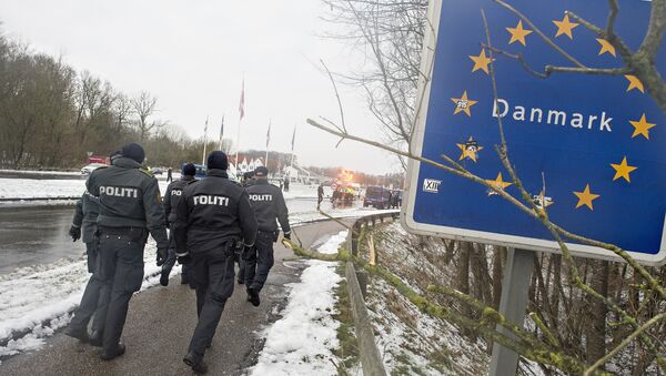 Police officers walk at the Danish-German border in Krusaa, Denmark - Sputnik International