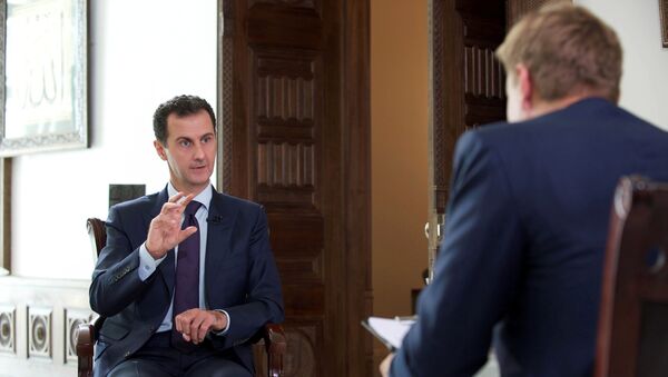 Syria's President Bashar al-Assad speaks during an interview with Denmark's TV 2, in this handout picture provided by SANA on October 6, 2016. - Sputnik International