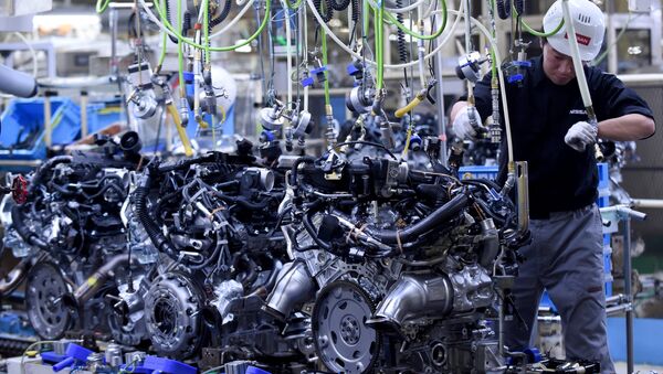 (FILES) This file photo taken on April 5, 2016 shows an employee working at the main assembly line of V6 engines at the Iwaki Plant of Japan's Nissan Motor in Iwaki, Fukushima prefecture - Sputnik International