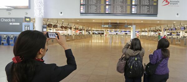 Stranded passengers check a flight information board as all flights are cancelled, during a nationwide general strike at Brussels airport (File) Stranded passengers check a flight information board as all flights are cancelled, during a nationwide general strike at Brussels airport (File) - Sputnik International