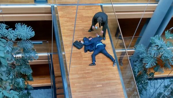 A still image taken from video shows a man, believed to be UK Independence Party (UKIP) Member of the European Parliament (MEP) Steven Woolfe, face down on a floor at the European Parliament in Strasbourg, France, October 6, 2016. - Sputnik International