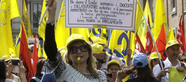 Protestors march during a rally against the government's education reforms, in Rome (File) Protestors march during a rally against the government's education reforms, in Rome (File) - Sputnik International