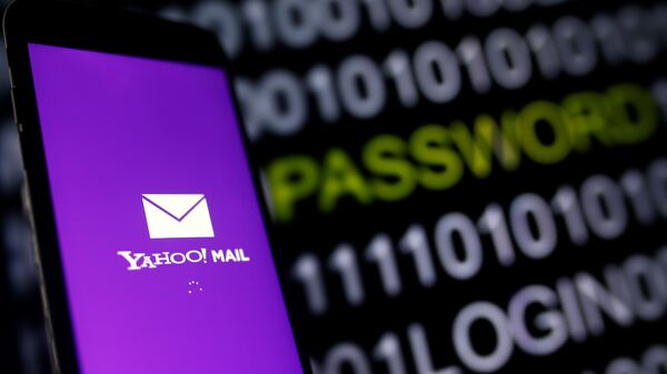Yahoo Mail logo is displayed on a smartphone's screen in front of a code in this illustration taken in October 6, 2016. - Sputnik International