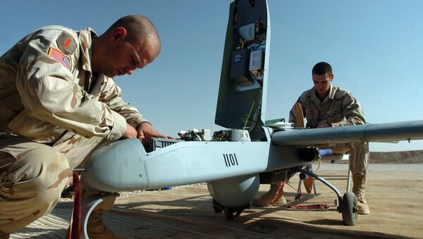 Spc. Robert Clarno of Sierra Vista, Ariz., left, and Spc. Jeremy Squires of Wellsboro, Penn., perform maintenance on a Shadow Unmanned Aerial Vehicle following its fllight at an American military base in Baqouba, Iraq in this Aug. 31, 2004 file photo - Sputnik International