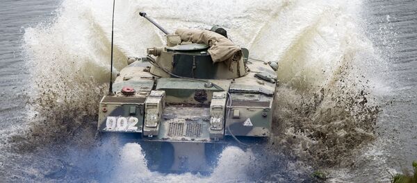 A BMD-2 airborne fighting vehicle crosses a water obstacle during a command & headquarters exercise involving the 106th Guards Airborne Division in Russia's Ryazan Region - Sputnik International