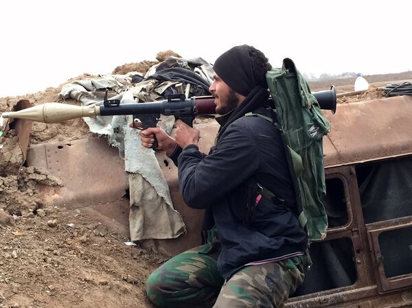 A supporter of the Syrian government holds a position in the northeastern Syrian city of Deir ez-Zor. File photo A supporter of the Syrian government holds a position in the northeastern Syrian city of Deir ez-Zor. File photo - Sputnik International