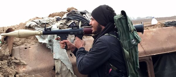 A supporter of the Syrian government holds a position in the northeastern Syrian city of Deir ez-Zor. File photo A supporter of the Syrian government holds a position in the northeastern Syrian city of Deir ez-Zor. File photo - Sputnik International